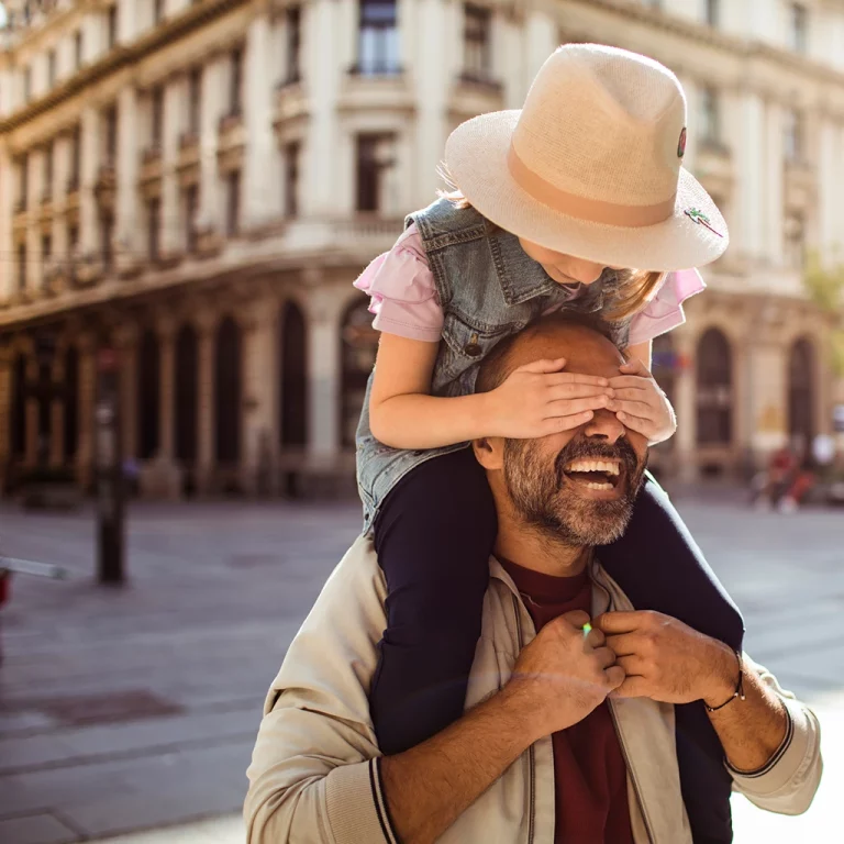 Parent with child on shoulders